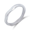 Wavy unisex ring with a smooth polished steel surface on a white background