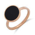 Ring with a round black accent and pinkish gold plating on white