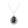 Dark blue teardrop crystal in a double cubic zirconia frame on a gold-plated chain
