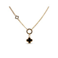 Gold-plated chain with a decorative circle, black clover pendant and tiny open clover