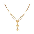 Gold-tone necklace with three embossed clover charms and two chain types