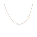 Fine gold-plated necklace with a heartbeat pendant set to the side, white background