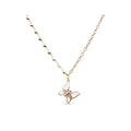 Necklace with a white enamel butterfly on a gold-plated heart chain