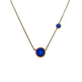 Gold-plated necklace with a large bright blue cubic zirconia and smaller blue stone
