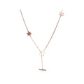Long rose gold-tone necklace with snowflakes and a dangling bar on white
