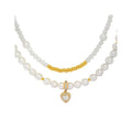 Double-strand faux pearl necklace with a cubic zirconia heart and gold-tone spacers
