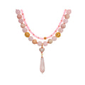 Two-strand pink stone necklace with a cubic zirconia heart and quartz drop