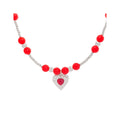 Red chalcedony bead necklace with an embossed silver-tone heart pendant
