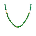 Green necklace of faceted crystals with white pearls and a geometric gold-tone centre