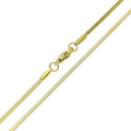 Close-up of a gold-plated snake chain with a lobster clasp on white