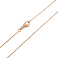 Fine 0.7 mm chain close-up with a lobster clasp, warm gold tone