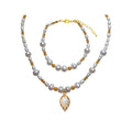 Pearl necklace with a leaf pendant and matching bracelet with golden spacers