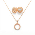 Ribbed gold-plated round earrings and an open ring pendant on a snake chain