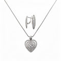 Necklace with a cubic zirconia heart pendant and long earrings in silver tone