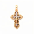Two-tone cross pendant with a silver-tone crucifix, clear stones and ornate border