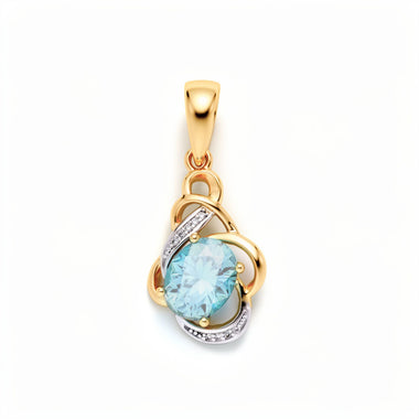 Ornate pendant with a light blue stone