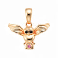 Owl pendant with spread wings, black eyes and a purple stone, gold-plated
