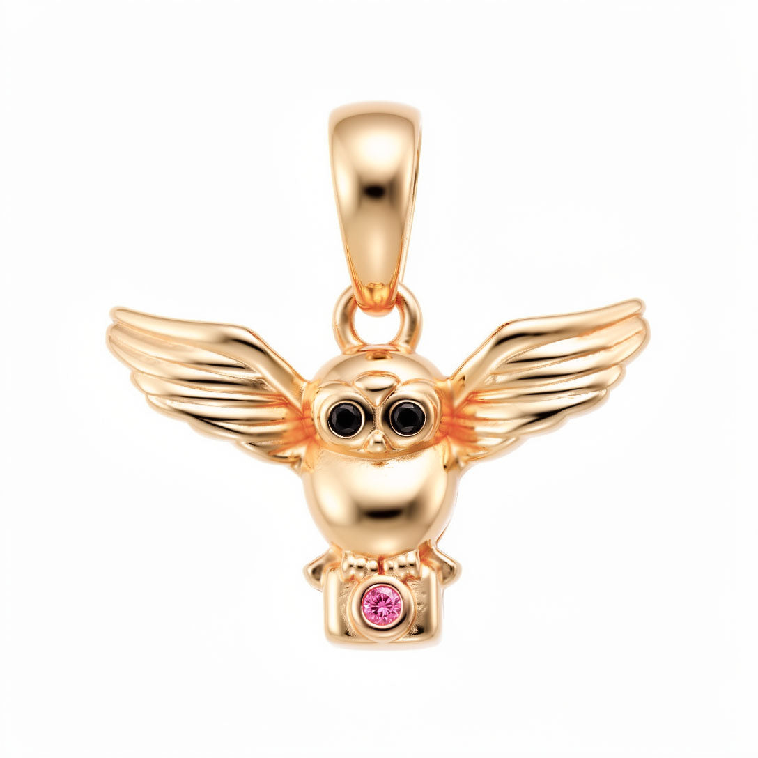 Owl pendant with spread wings, black eyes and a purple stone, gold-plated