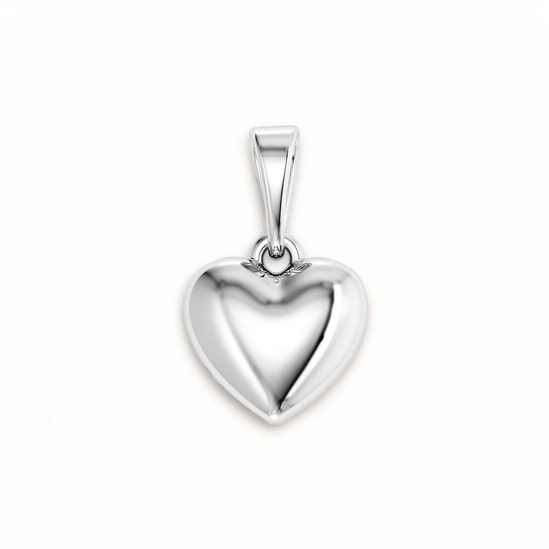 Puffed smooth heart pendant with platinum plating, no stones, on a light background