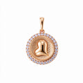 Round pendant with a domed heart and a white cubic zirconia rim on white