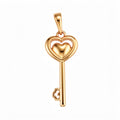 Gold-plated key pendant with a heart outline and a small domed heart