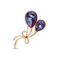 Gold-plated hot air balloon brooch with two violet crystals and a zirconia bow