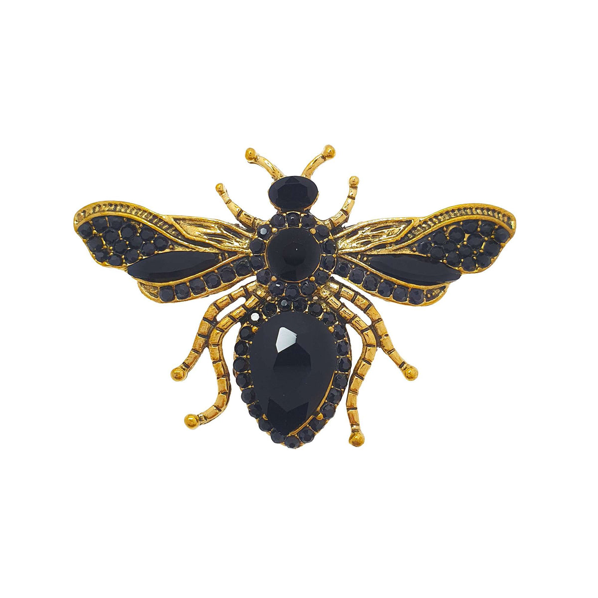 Bee brooch with a gold-plated body and black crystals in the wings, white background