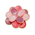 Flower brooch with pink and violet enamel petals and a pink zirconia centre