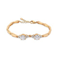 Gold-plated bracelet with two large cubic zirconia, tiny stones and an extension chain