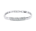 Silver-tone bracelet with wavy links and a central band of clear stones