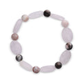Stretch bracelet with pale pink quartz ovals and speckled jasper beads on white