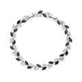 Silver-tone bracelet with black and clear marquise stones in a leaf pattern