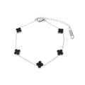 Silver-tone chain bracelet with five black clovers and an extension chain