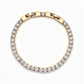 Tennis bracelet with a row of clear cubic zirconia and a gold-tone box clasp