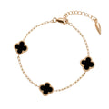 Gold-plated bracelet with three black four-leaf clover motifs