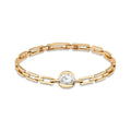 Gold-tone rectangular link bracelet with a large round sparkling stone at the centre