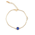 Fine chain bracelet with a round blue crystal in a cubic zirconia frame