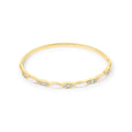 Gold-plated bangle with white oval inlays and clusters of sparkling cubic zirconia