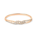 Rigid bangle with openwork filigree and a leaf pattern in cubic zirconia