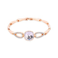 Rose gold-tone link bracelet with a large square crystal and cubic zirconia drops