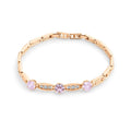 Bracelet with three pink hexagon stones and cubic zirconia on white