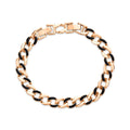 Curb chain bracelet with black enamel inlays and gold-tone links, rectangular clasp