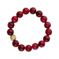 Pink tiger's eye bead bracelet with a gold-plated heart-pattern bead and cubic zirconia